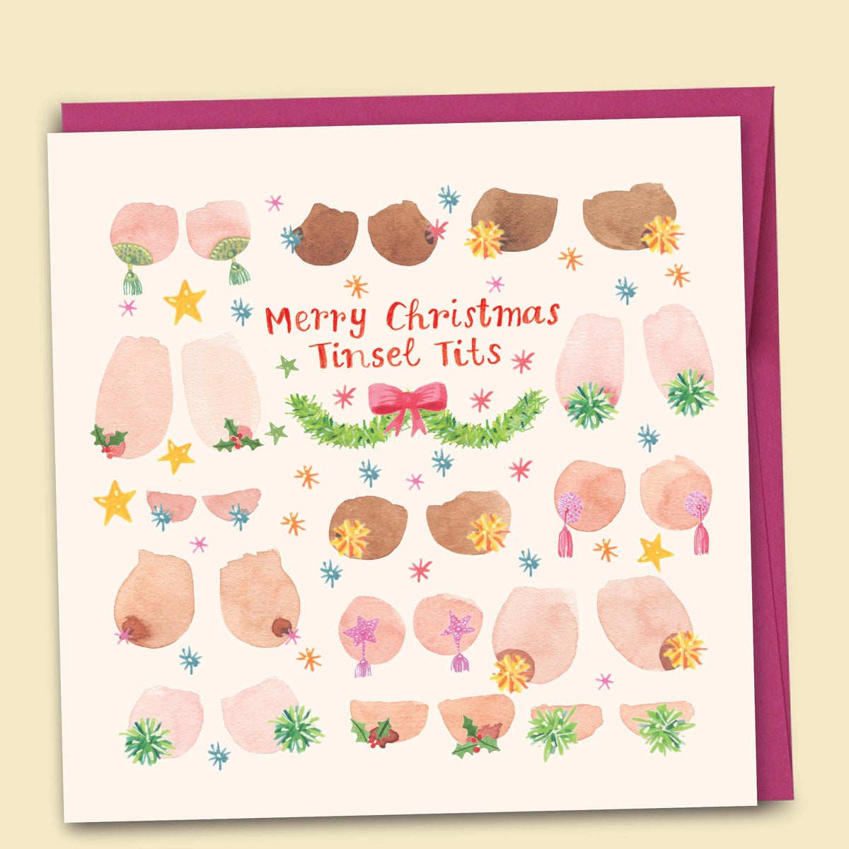 Funny Christmas card with watercolour illustrations of diverse boobs in all shapes and sizes wearing festive nipple tassels with stars holly and tinsel reading Merry Christmas Tinsel Tits with pink envelope