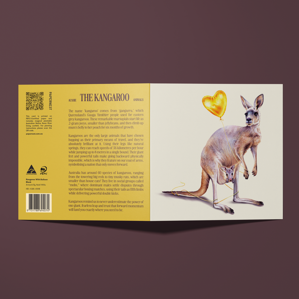 Greeting card with a watercolour illustration of a  kangaroo with a joey in her pouch, holding a gold heart shape balloon which is tangled around her legs. 
