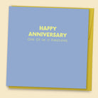 Funny anniversary card with blue background and yellow text reading Happy Anniversary One of Us is Punching with yellow envelope.