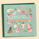 Funny cheeky Christmas card with watercolour illustrations of diverse penises in all shapes and sizes wearing Santa hats, tinsel, and festive bows reading Wishing You Lots of Hap-Penis at Christmas with festive envelope